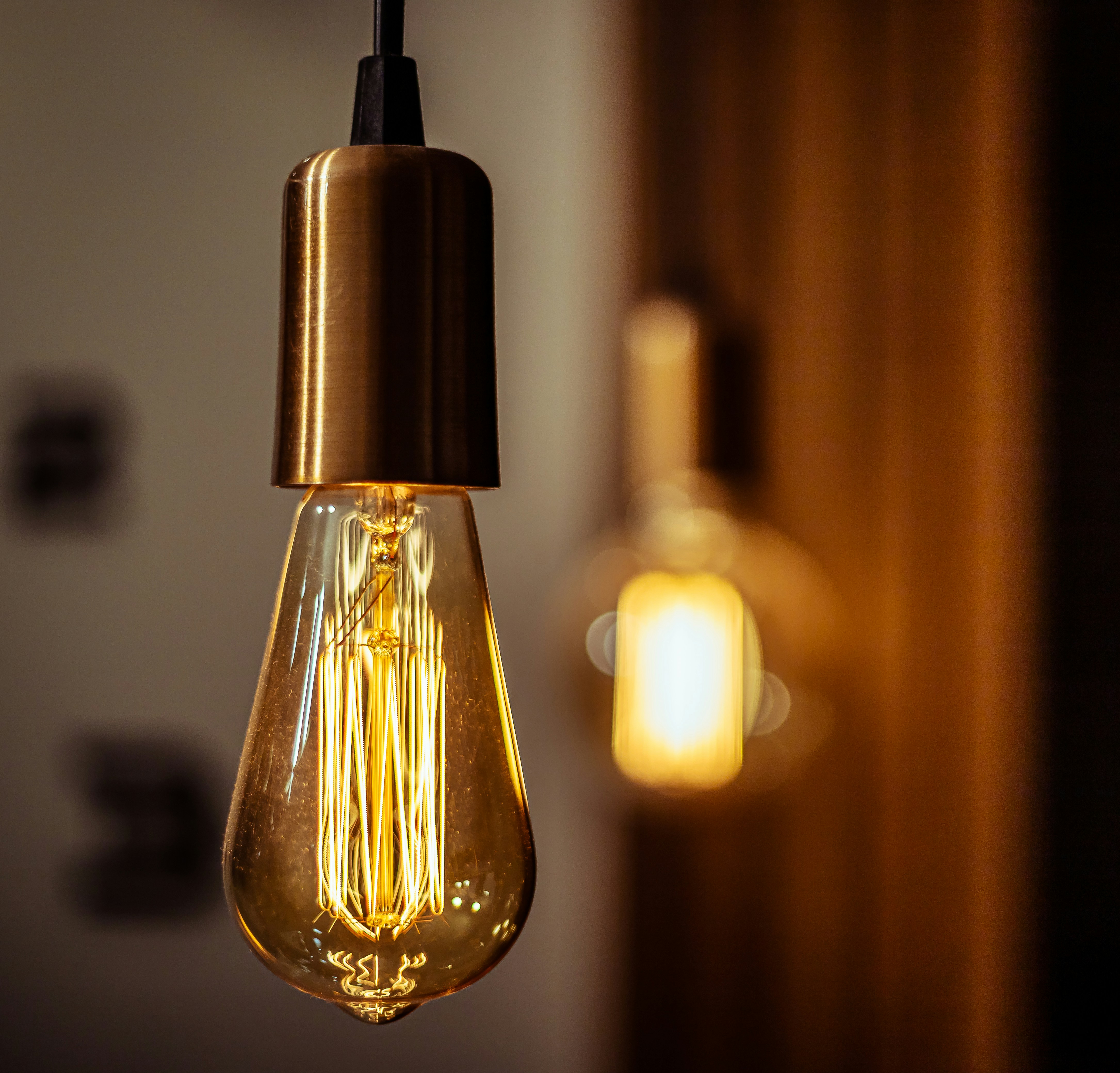 a light bulb hanging from a ceiling in a room