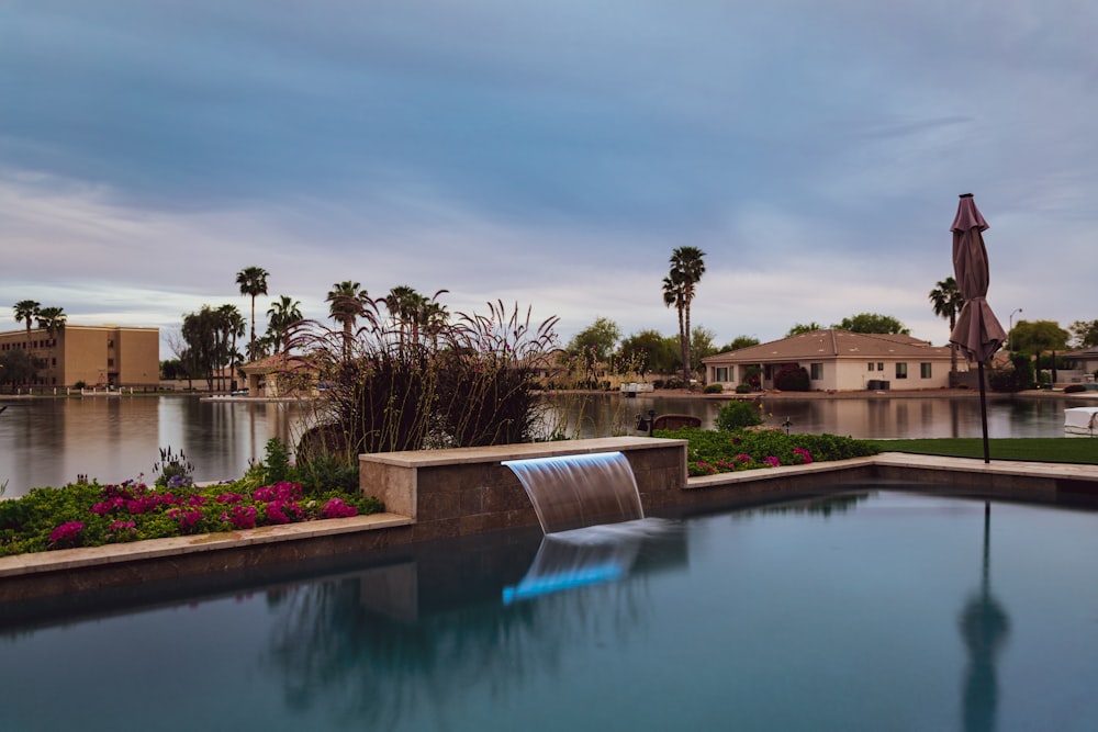 a large pool with a waterfall in the middle of it