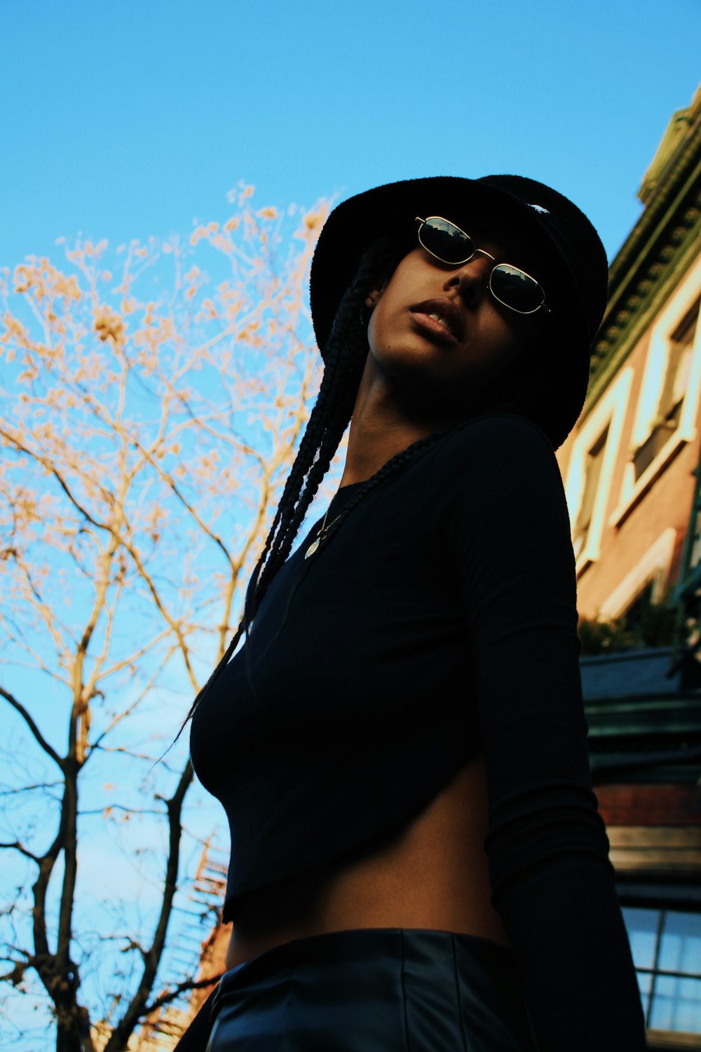 woman in black long sleeve shirt and black sunglasses