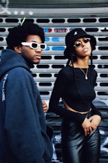 man in black hoodie wearing sunglasses