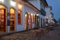 a cobblestone street lined with tables and chairs