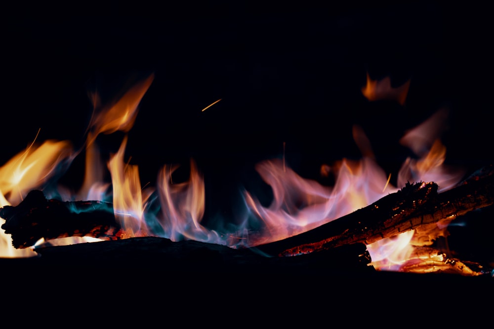 a close up of a fire in the dark