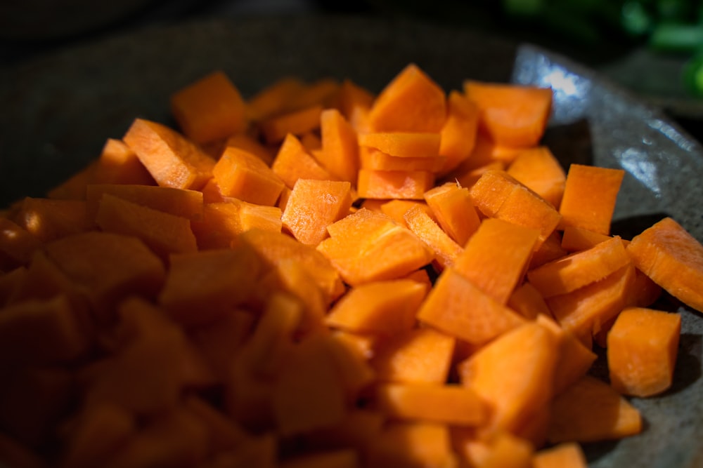 a pile of cut up carrots on a plate