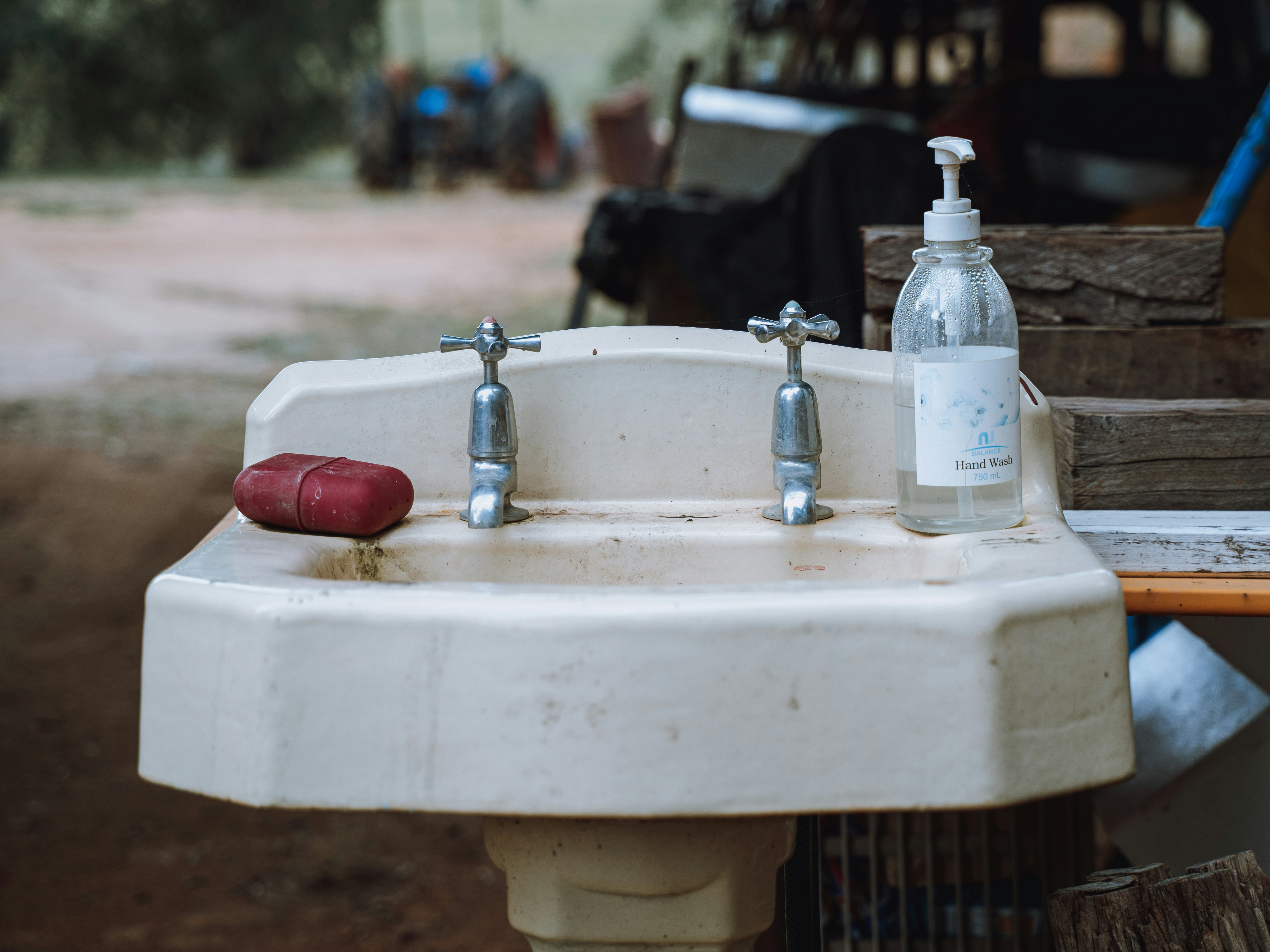 a white sink sitting next to a wooden table