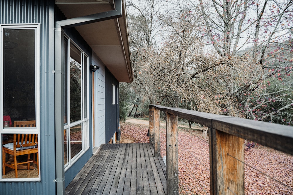 a wooden deck with a table and chairs on it