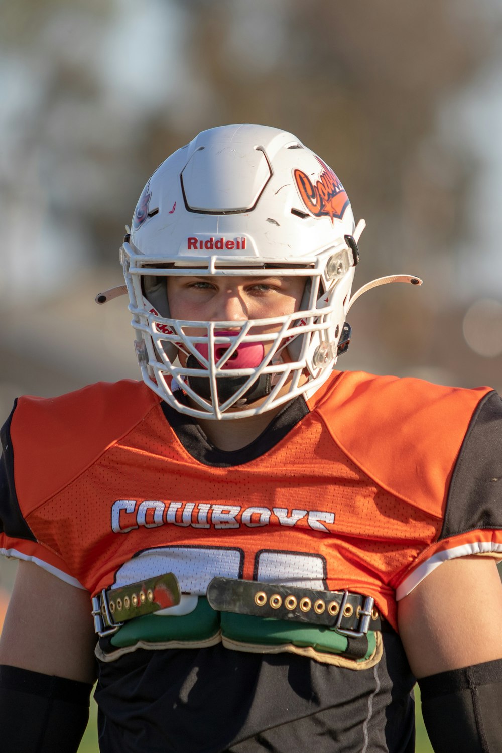 a football player wearing a helmet on a field