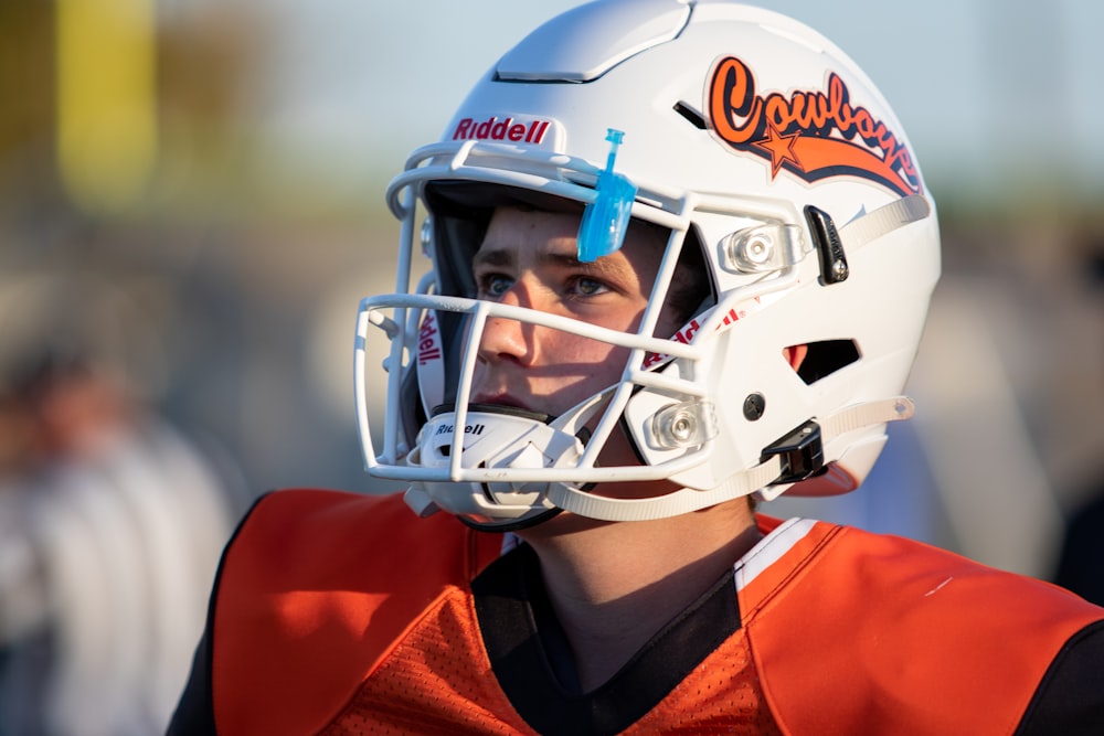 person in blue and white helmet and red and black jersey shirt