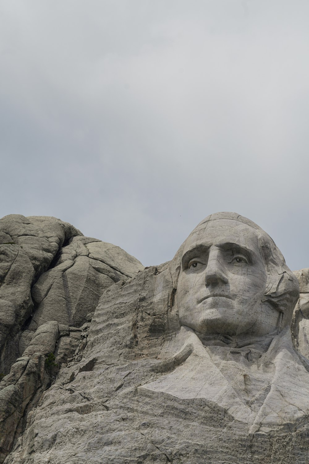a statue of abraham lincoln on top of a mountain