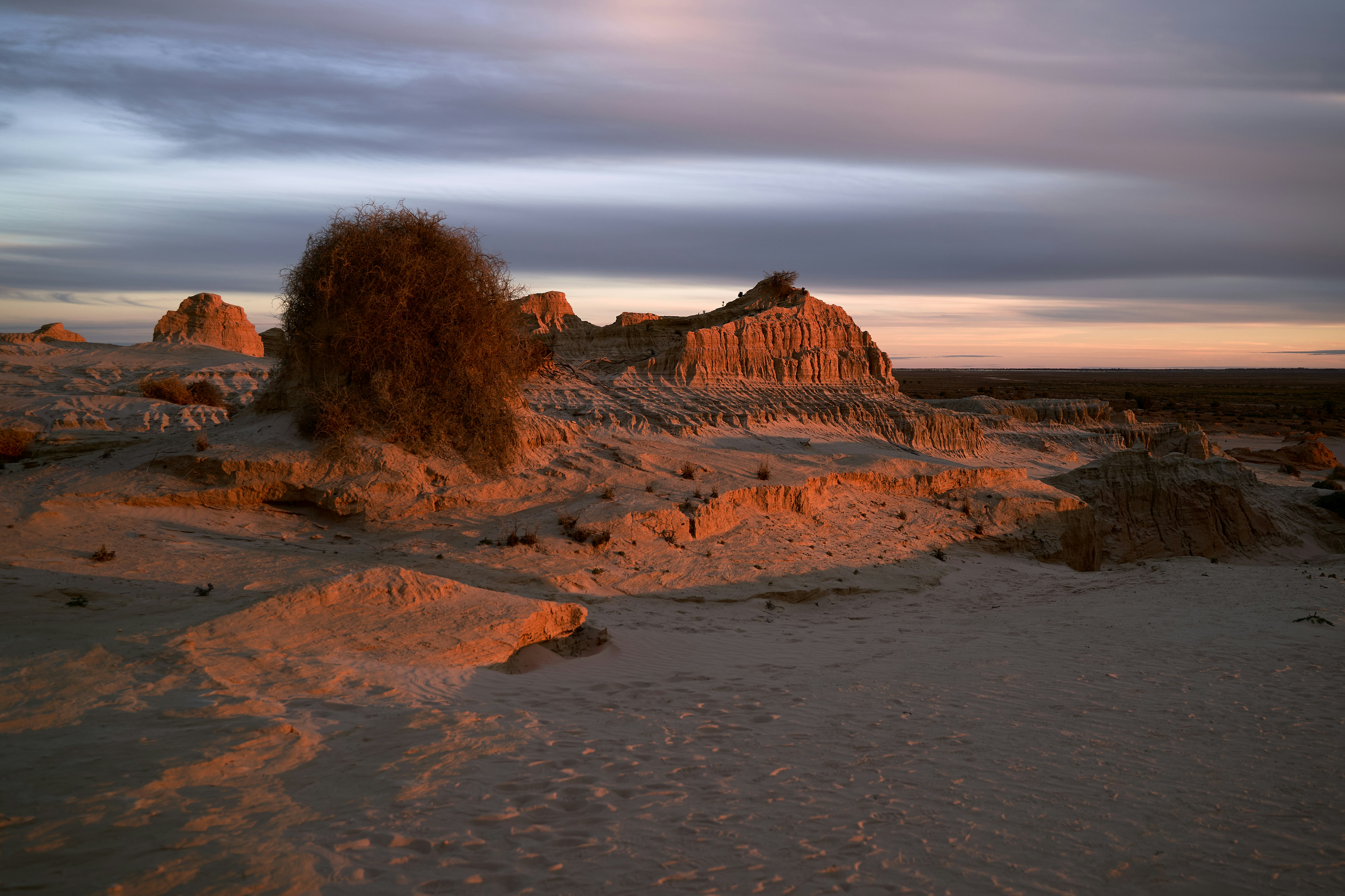 brown rock formation near body of water during daytime, 