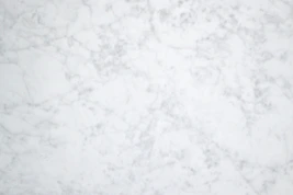 a close up of a white marble surface