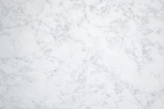 A serene marble background with soft gold veins, reflecting subtle elegance.