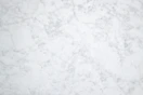 a close up of a white marble surface