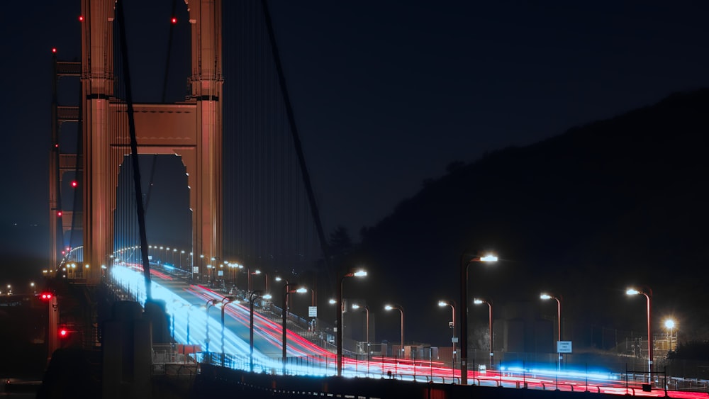 a long exposure photo of the golden gate bridge at night