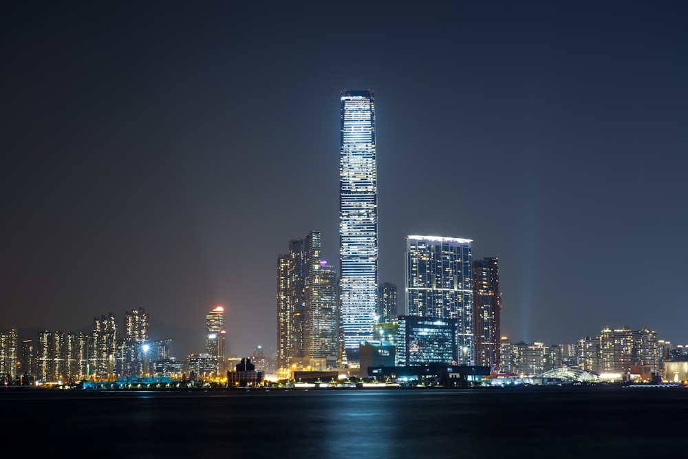 a very tall building in the middle of a city at night