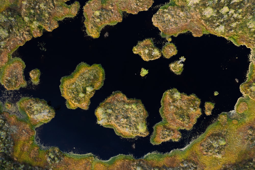 an aerial view of a body of water surrounded by land