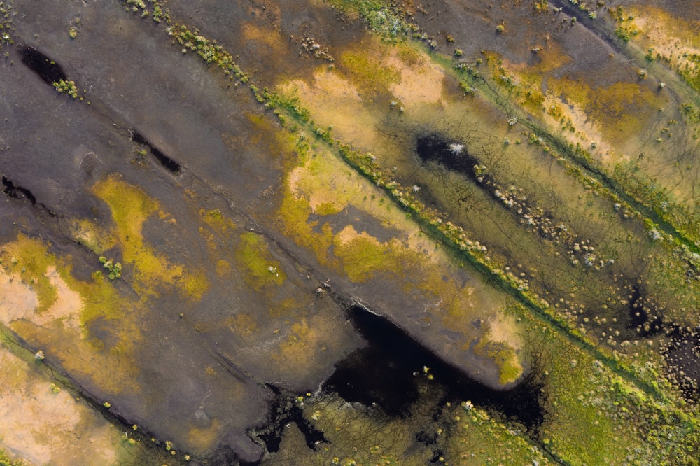 an aerial view of a field with grass and dirt