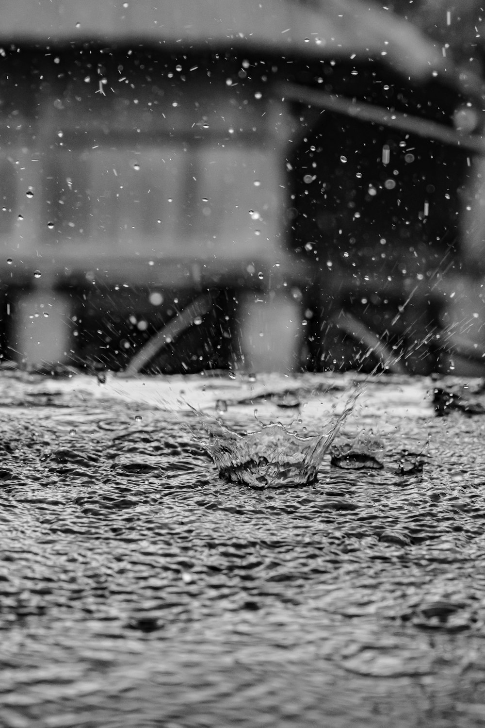 a black and white photo of a puddle of water