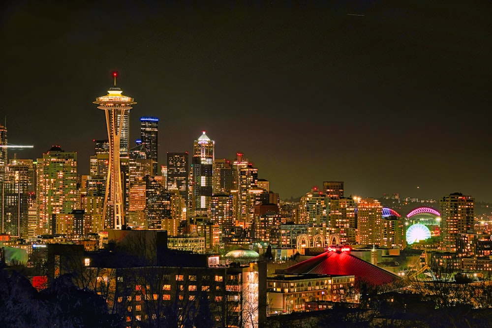 a view of a city at night from a hill