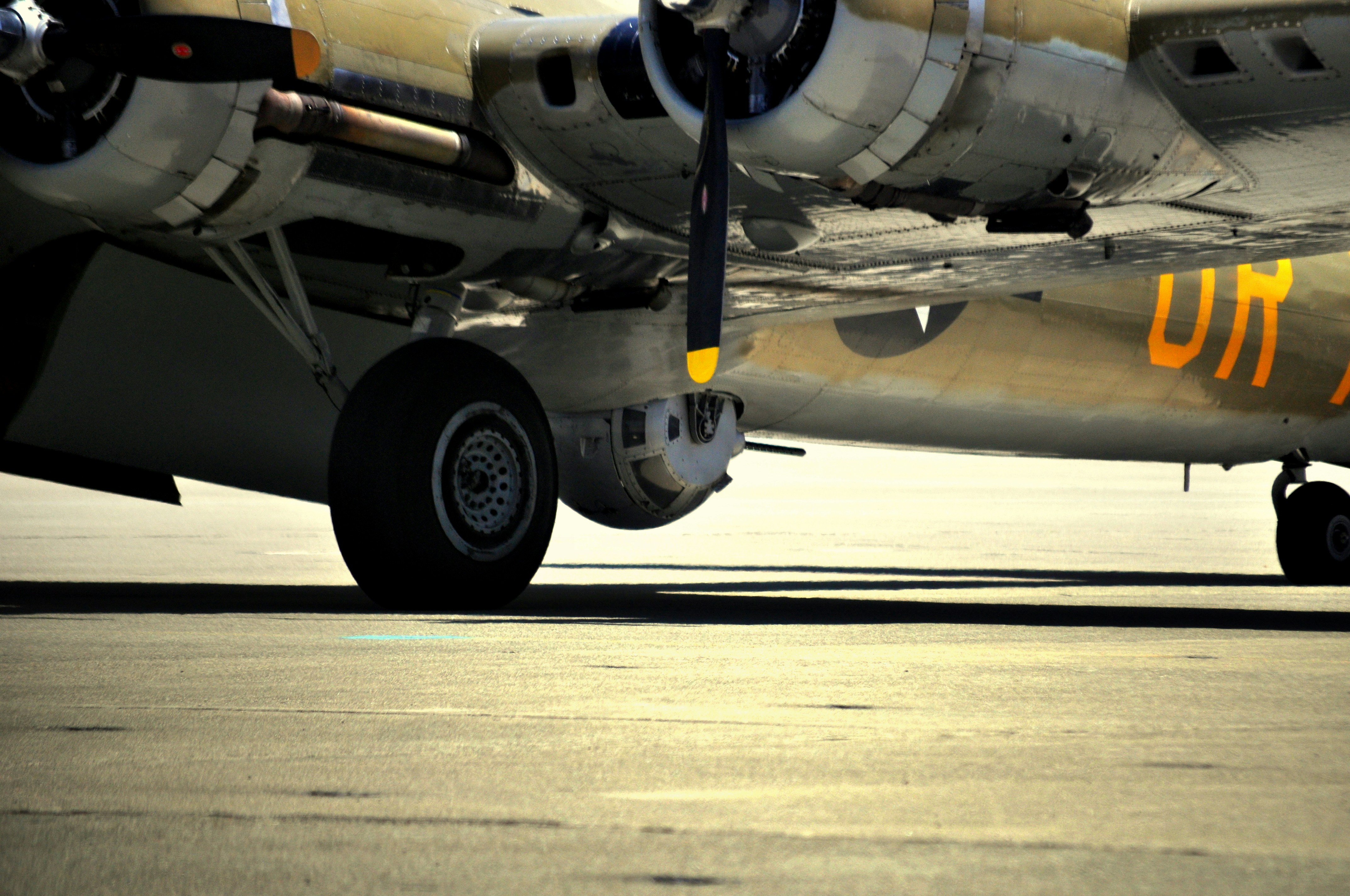 a close up of the nose of an airplane, The Boeing B-17 Flying Fortress is a four-engined heavy bomber developed in the 1930s for the United States Army Air Corps (USAAC). Sperry and Emerson Electric each developed a ball turret, and the designs were similar in the nose turret version. The Sperry ball turret was very small[clarification needed] in order to reduce drag, and was typically operated by the smallest man of the crew. To enter the turret, the turret was moved until the guns were pointed straight down. The gunner placed his feet in the heel rests and occupied his cramped station.