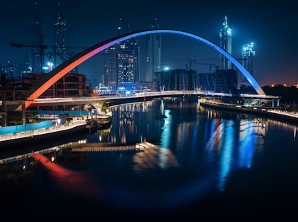 a bridge over a body of water at night