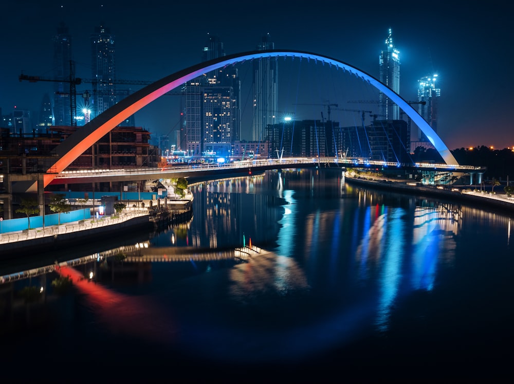 a bridge over a body of water at night