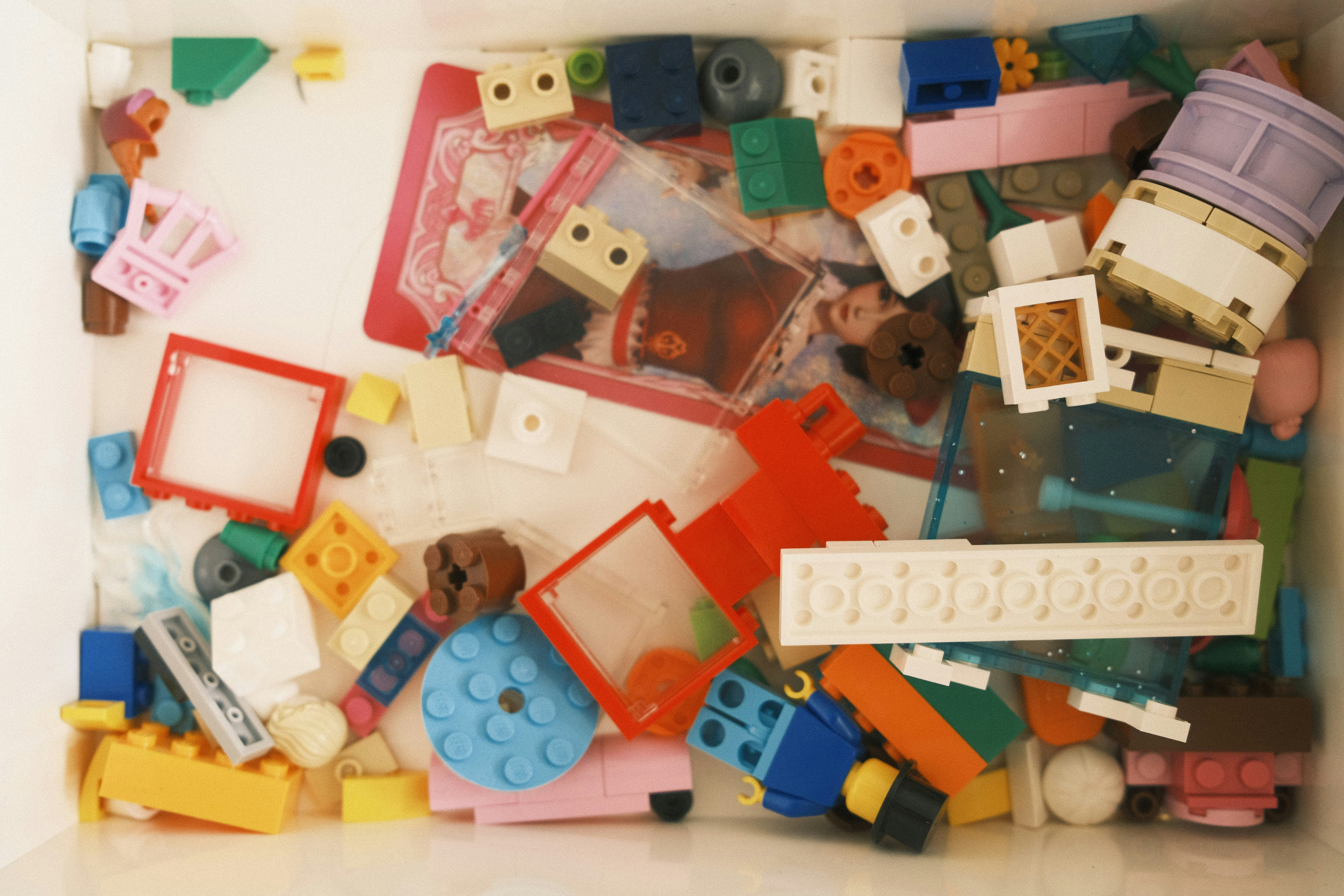 a box filled with lots of different colored legos