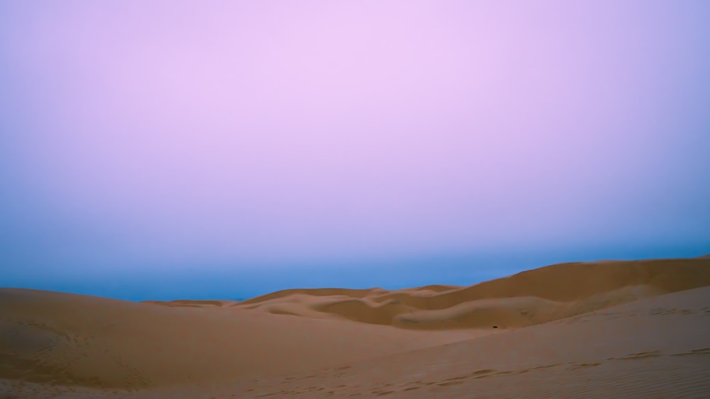 a large sand dune in the middle of a desert