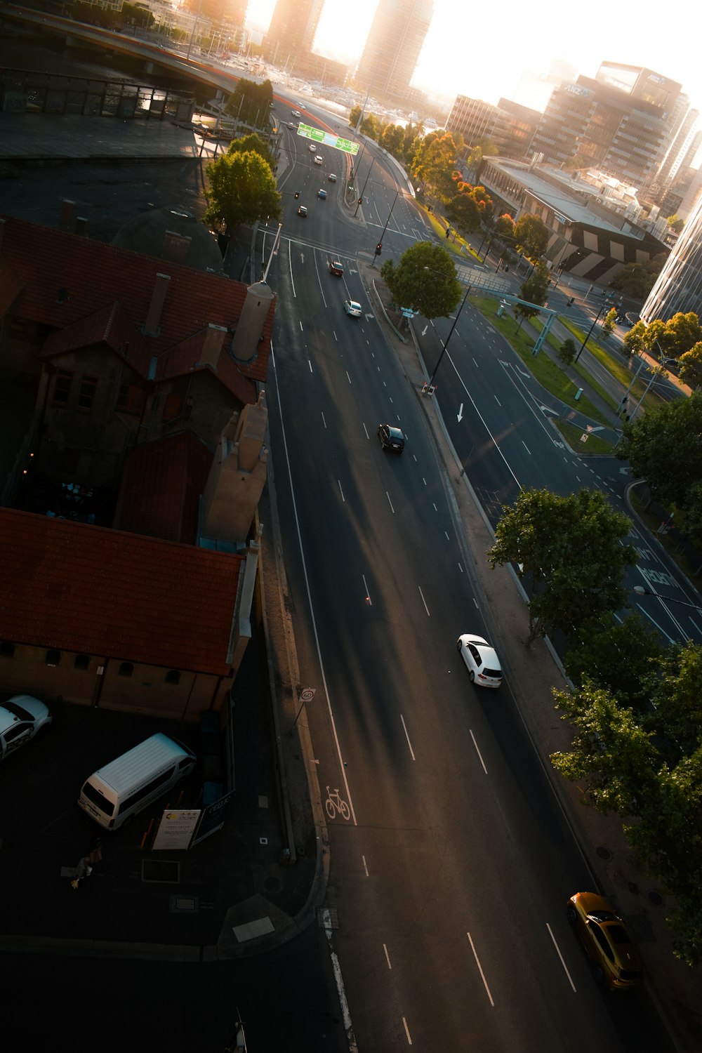 an aerial view of a city street at sunset