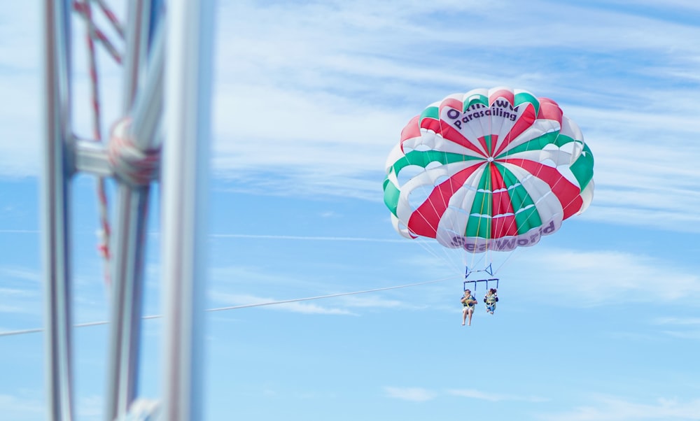 a large colorful kite flying through a blue sky