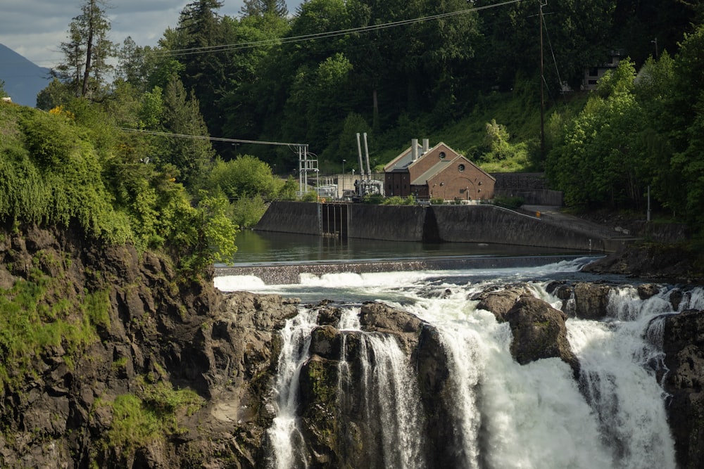 a large waterfall with a power line above it