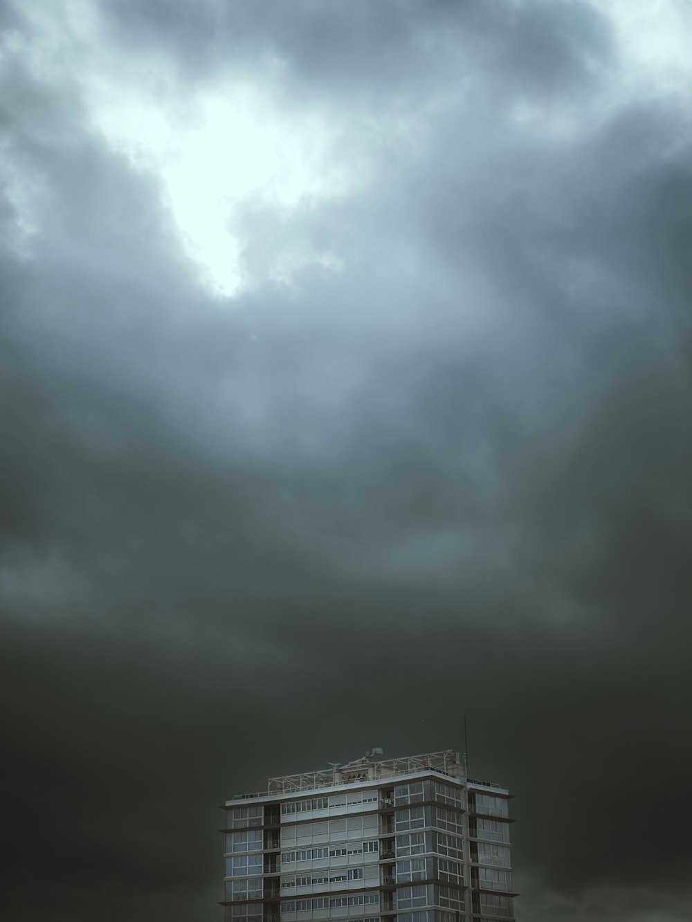 white clouds over city buildings during daytime