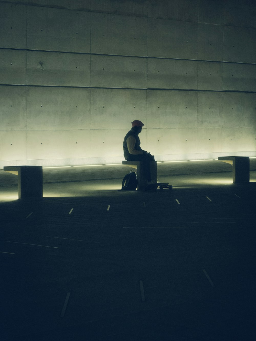 silhouette of person sitting on bench