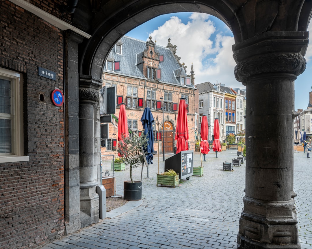 red and white flags on brown brick building