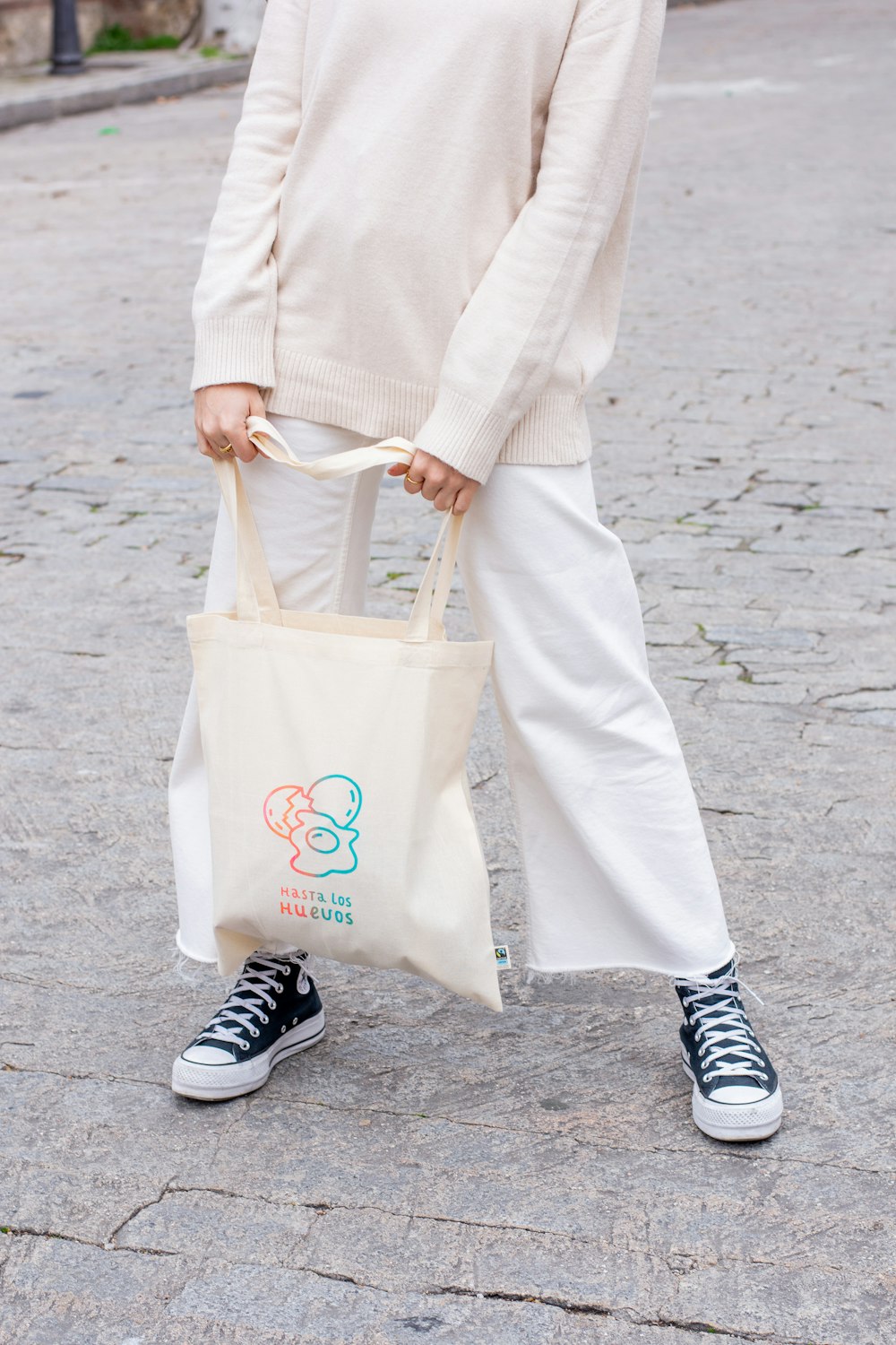 a woman carrying a bag on the street