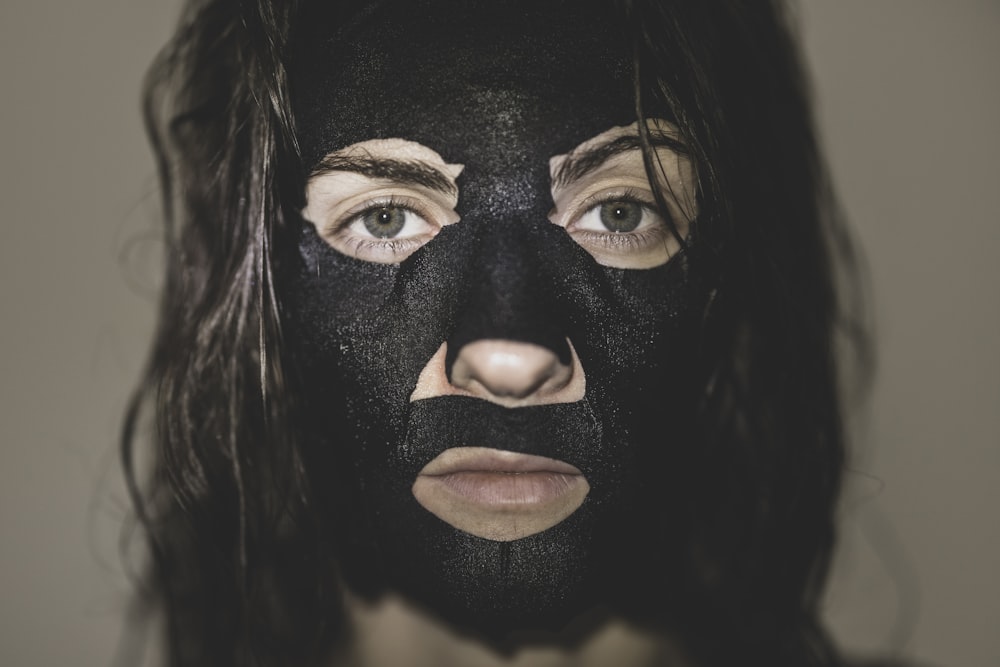 woman with black hair and black eye shadow