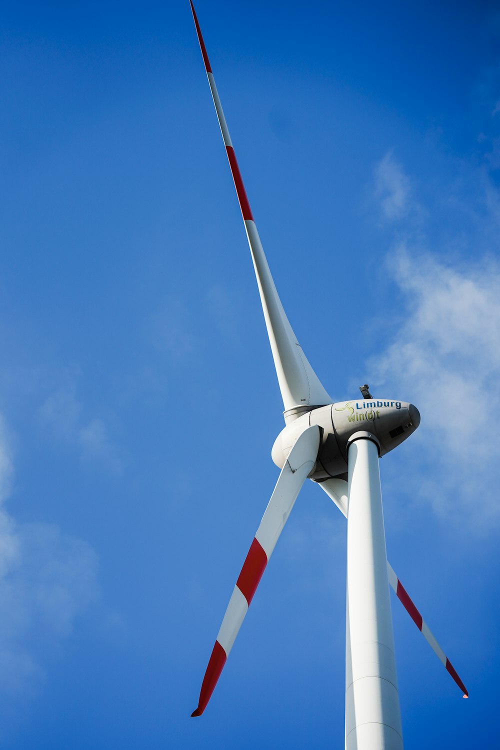 a wind turbine with red and white stripes on it