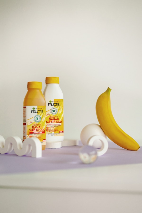 A banana and two bottles of juice on a table