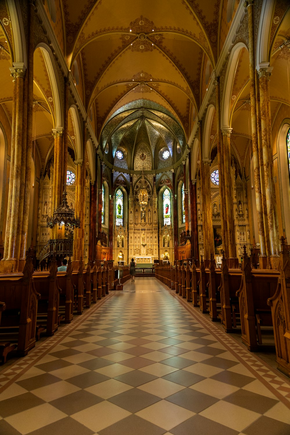 a church with a checkered floor and pews