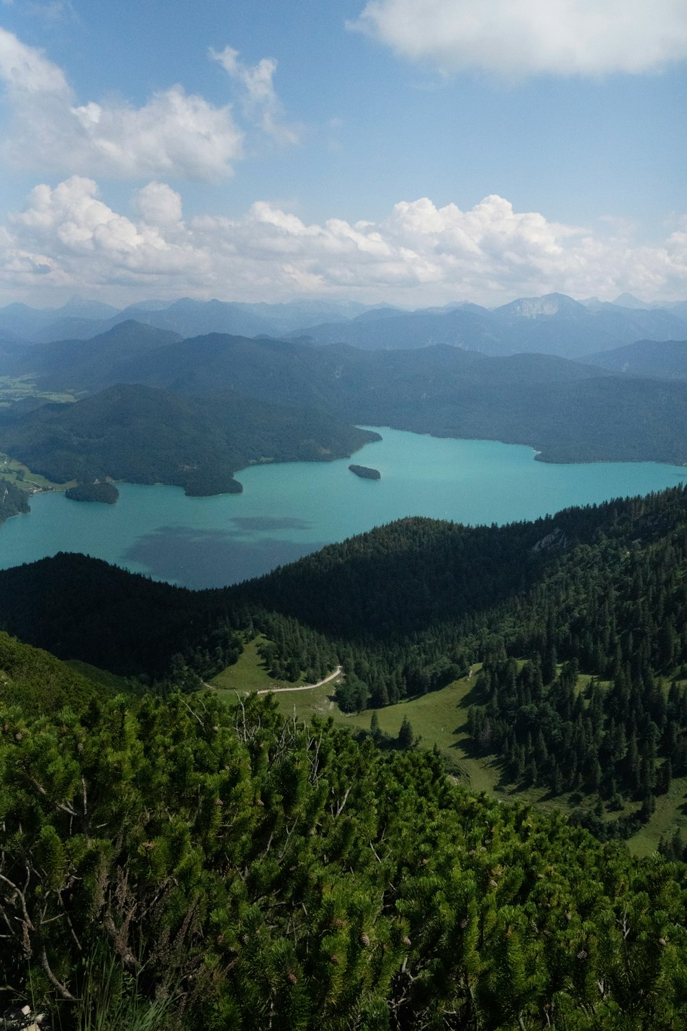 a scenic view of a lake surrounded by mountains