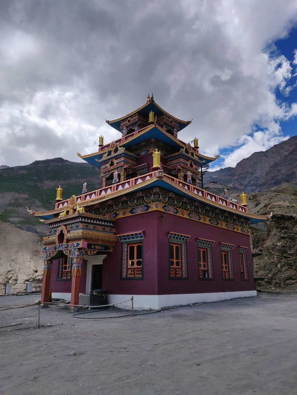 a red building with a yellow and blue roof