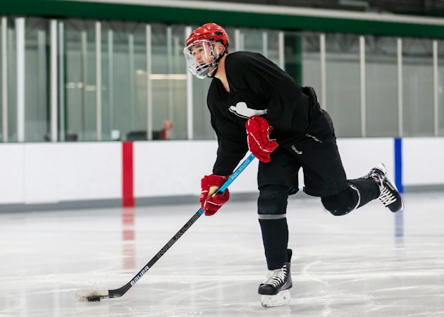 A hockey player on the ice with a stick, the kind of close-range chance Jack Eichel finished in overtime against the Utah Mammoth