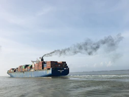 a large cargo ship with a lot of containers on it
