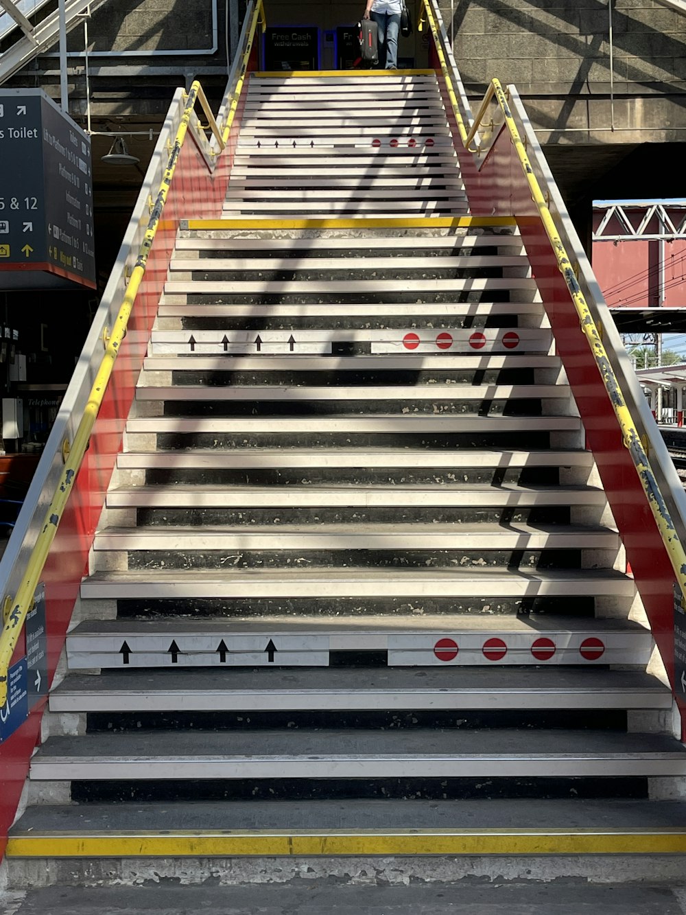 a man walking up a flight of stairs