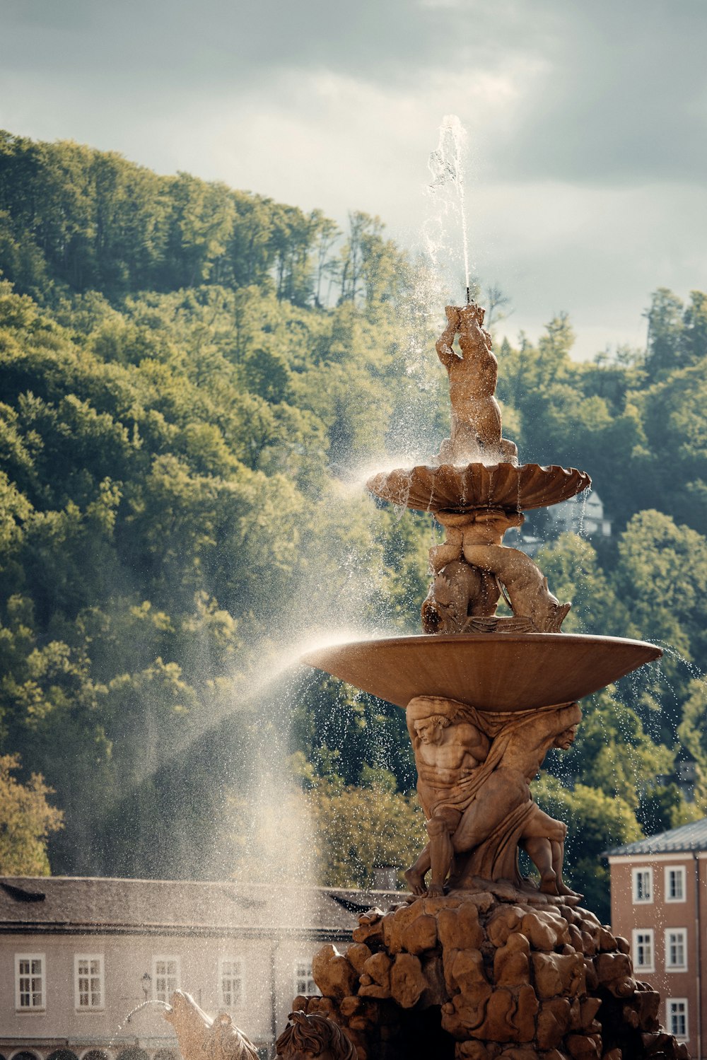 a water fountain with a statue on top of it