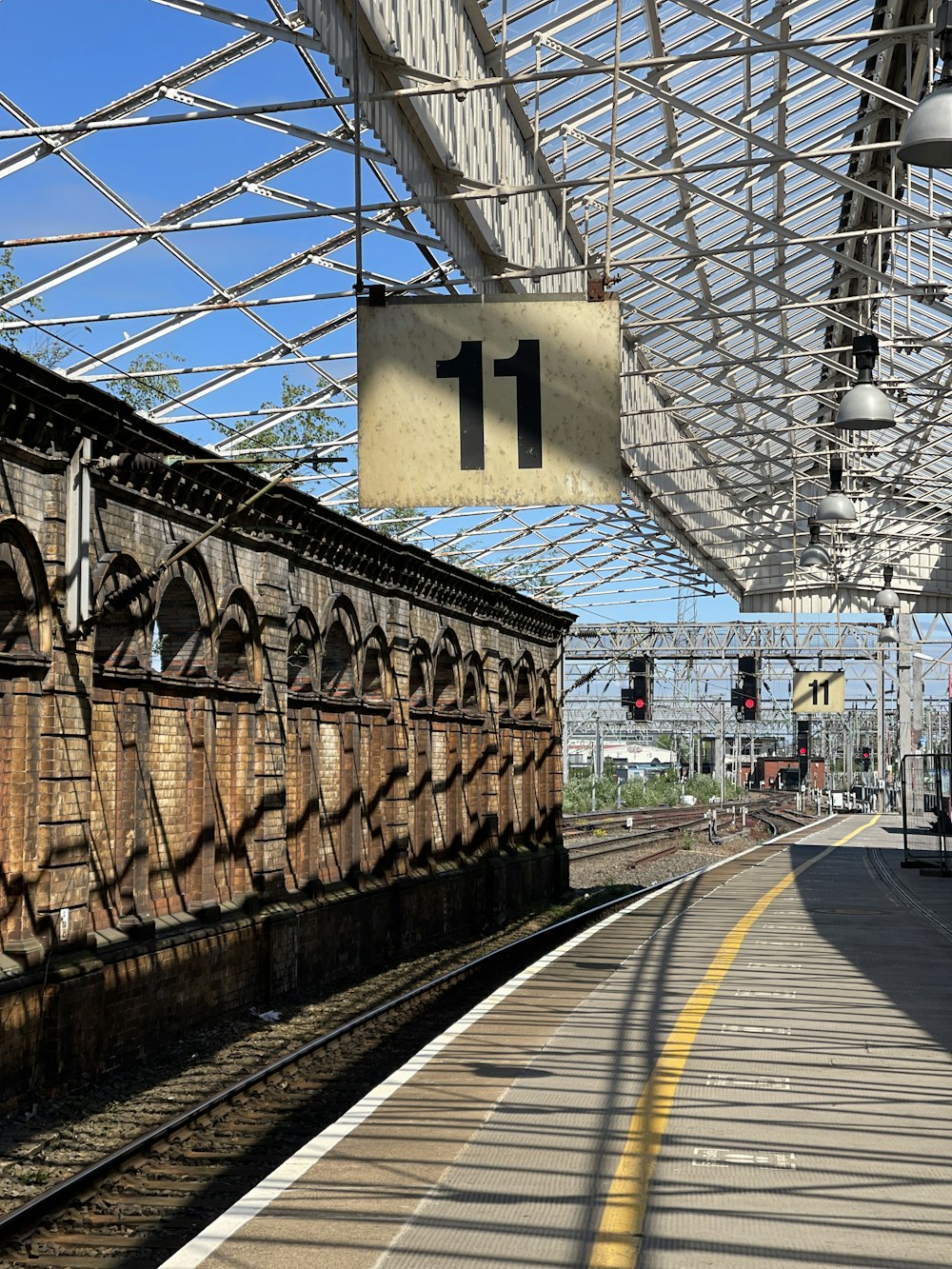 a train pulling into a train station next to a platform