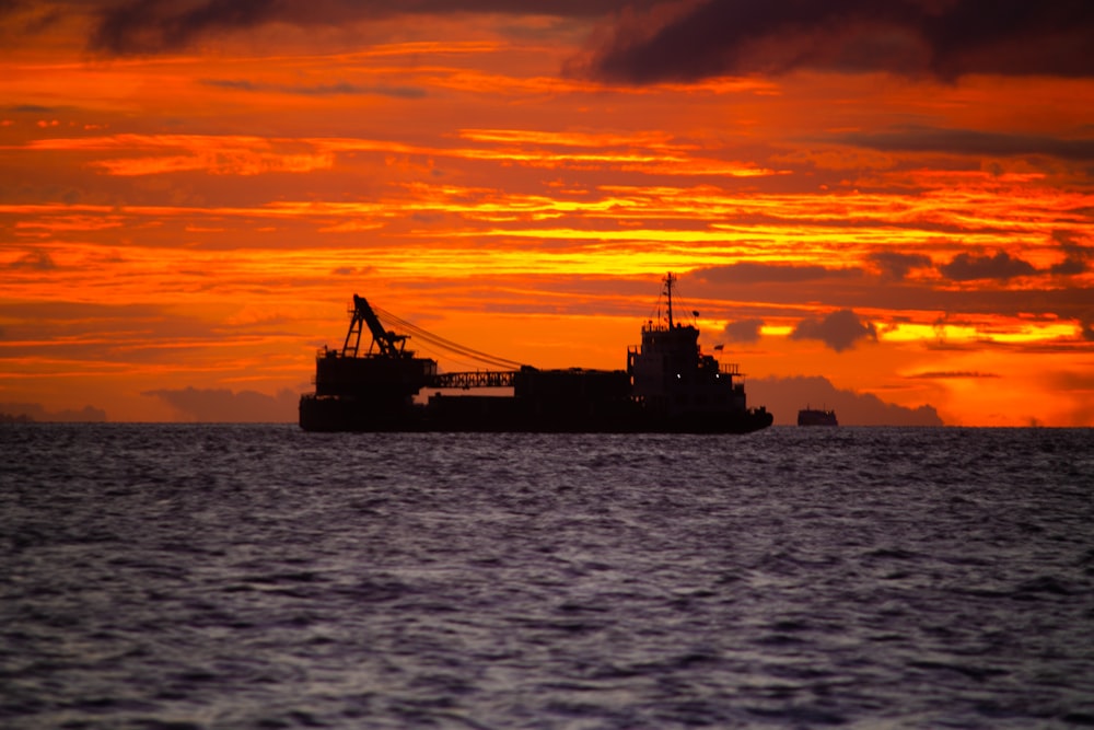 a large boat floating on top of a large body of water