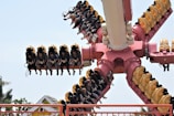a roller coaster with a bunch of people on it