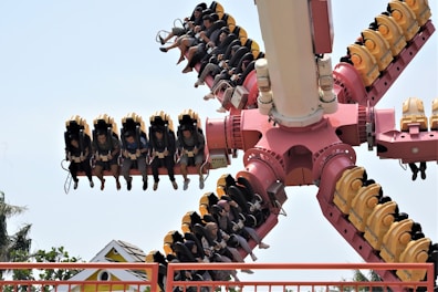 a roller coaster with a bunch of people on it