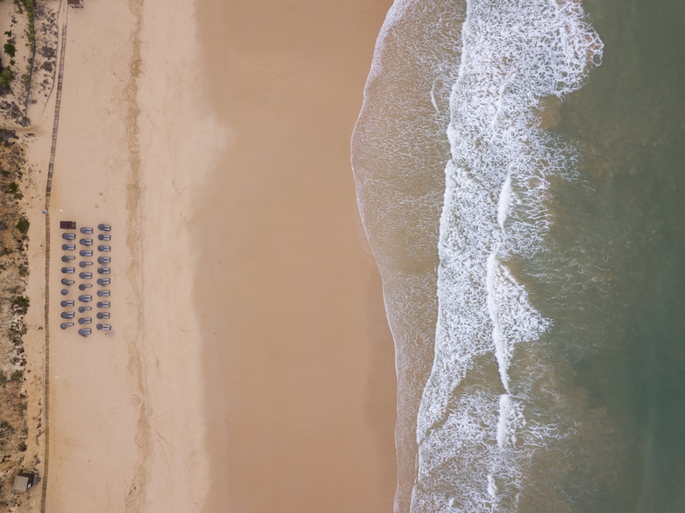 an aerial view of a sandy beach and ocean