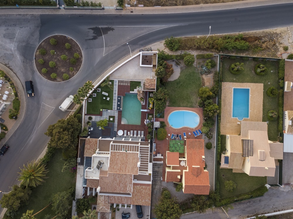 an aerial view of a house with a swimming pool